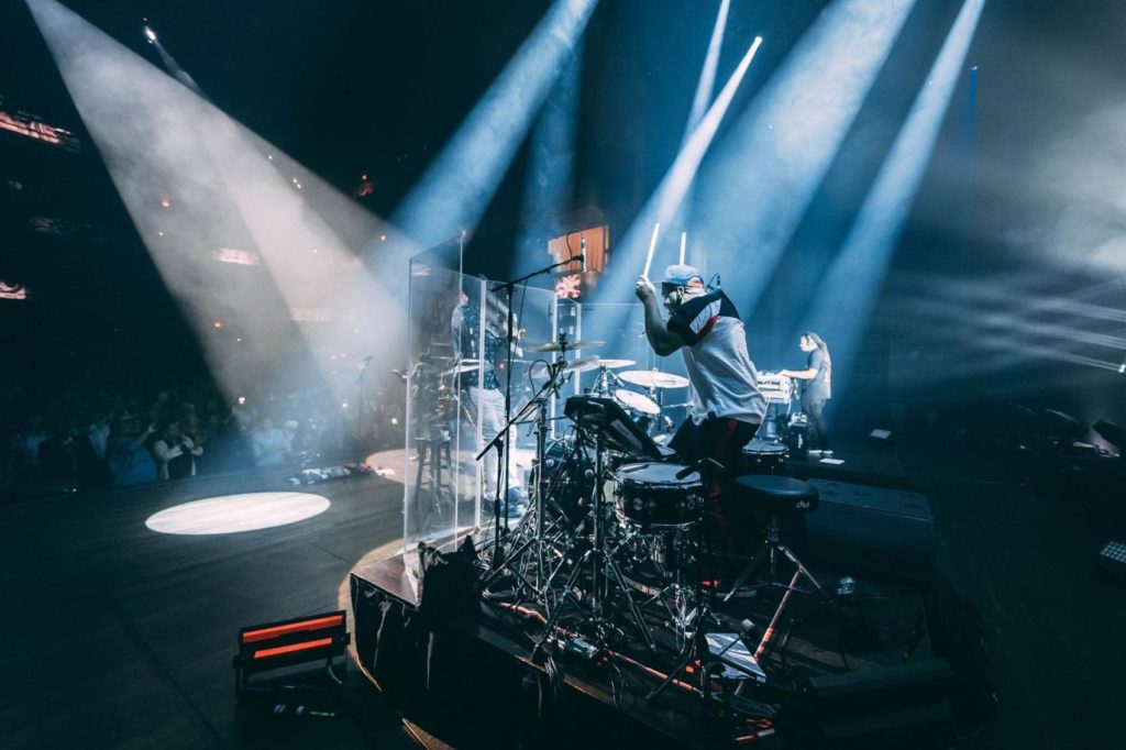 Drummer playing the drums at a concert