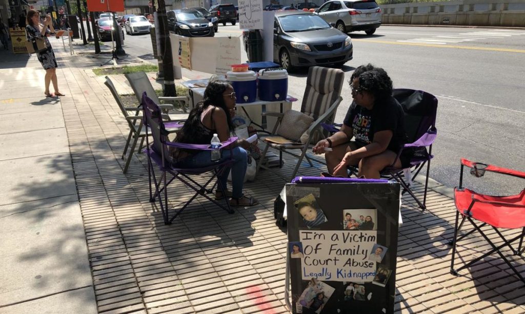 La-Sha Caddell, 27 (left) was a product of Philadelphia's foster care system. 