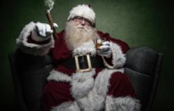 Image of Santa holding a drink and a cigar sitting in a chair