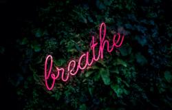 Image of a sign that reads "Breathe"