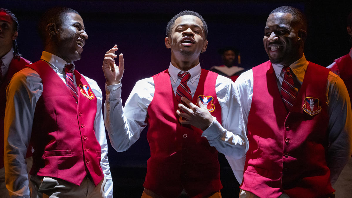 Choir Boy production photo of three actors in red vests