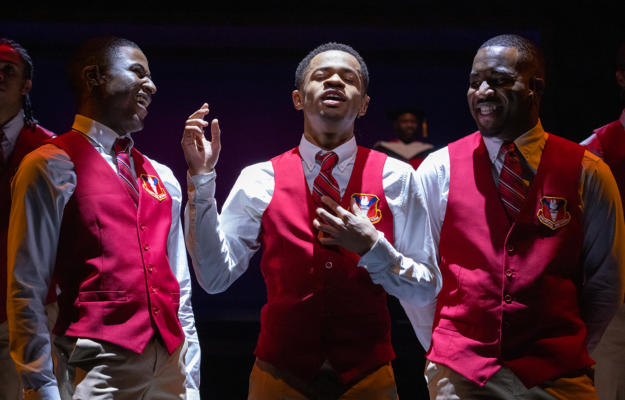 Choir Boy production photo of three actors in red vests