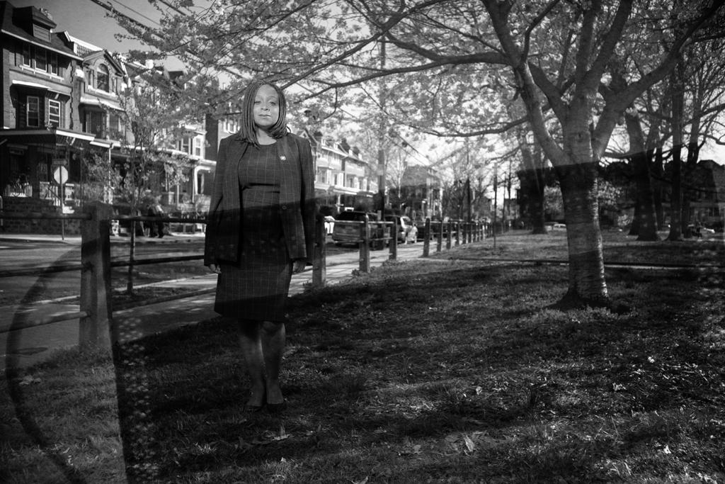 Jamie R. Gauthier stands in a city park.
