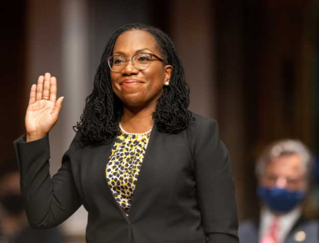 The former federal public defender raising her hand as she gets sworn into proviiding testimony before the Senate Judiciary Committee.