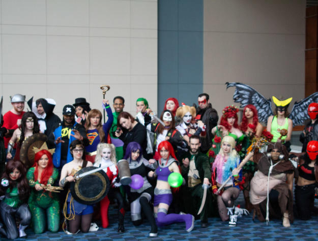 A group of people in costume pose for a photo