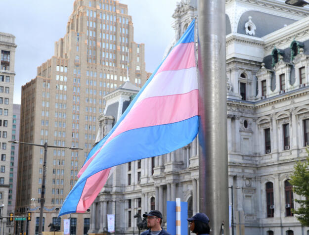 The trans pride flag raising in front of City Hall in 2017.