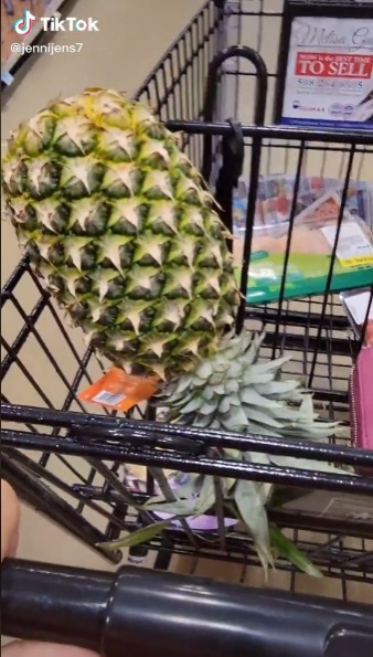 an upside down pineapple in a grocery cart